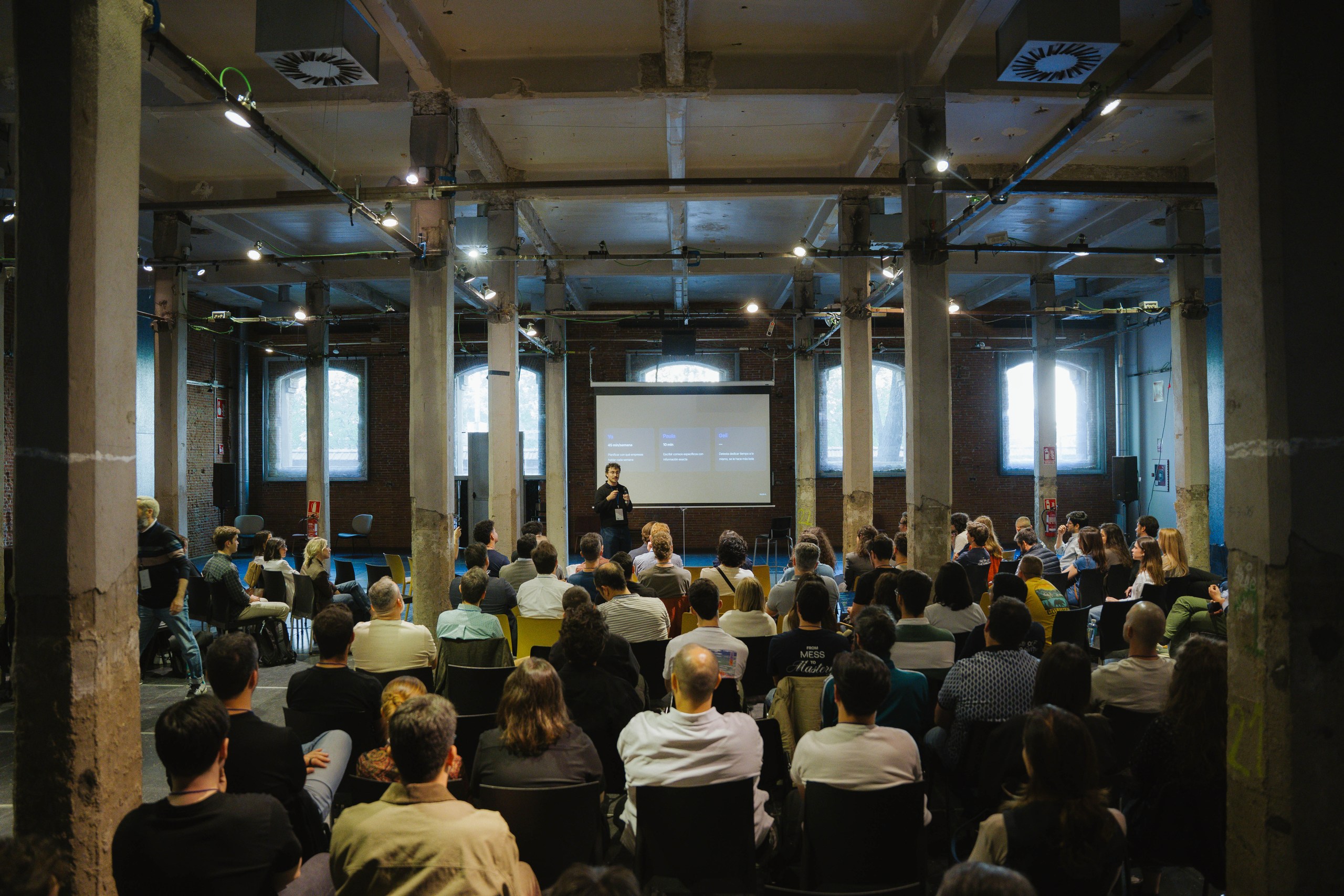 Wide shot of the Ahead Madrid audience at Matadero during the sales segment