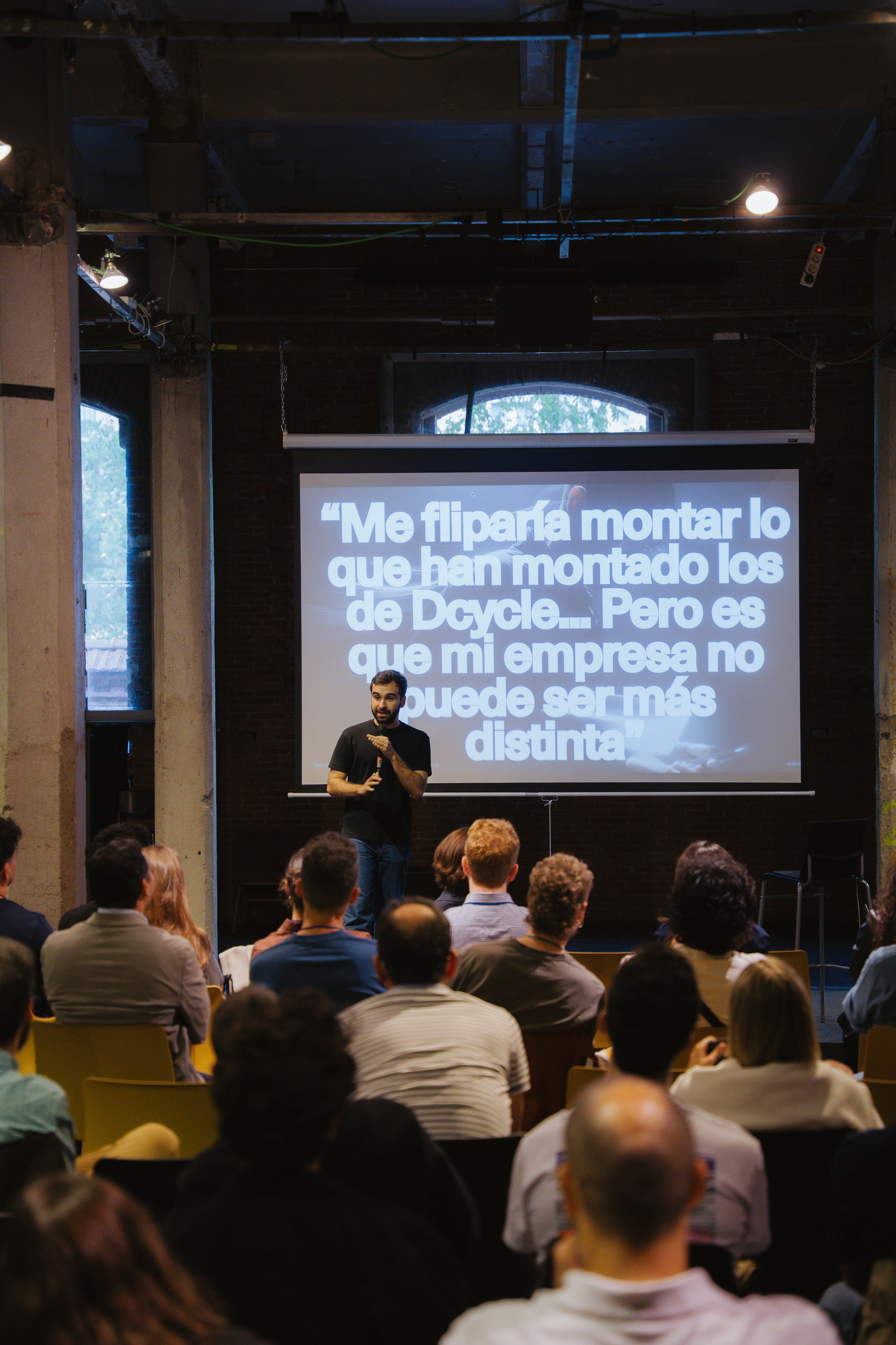 Speaker showing audience quote on screen: I would love to build what Dcycle built