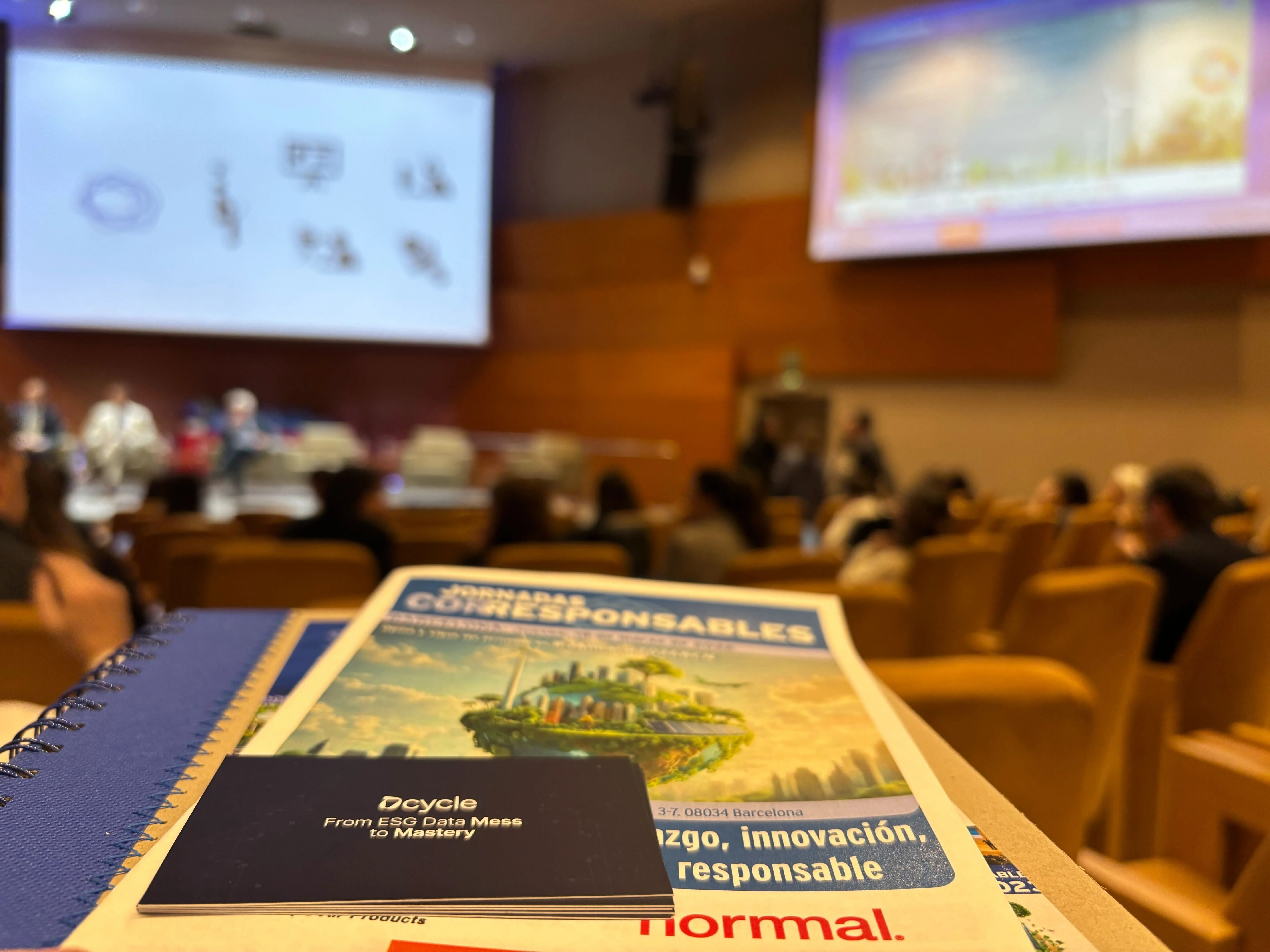 Dcycle From ESG Data Mess to Mastery notebook in the IESE auditorium at Corresponsables Barcelona