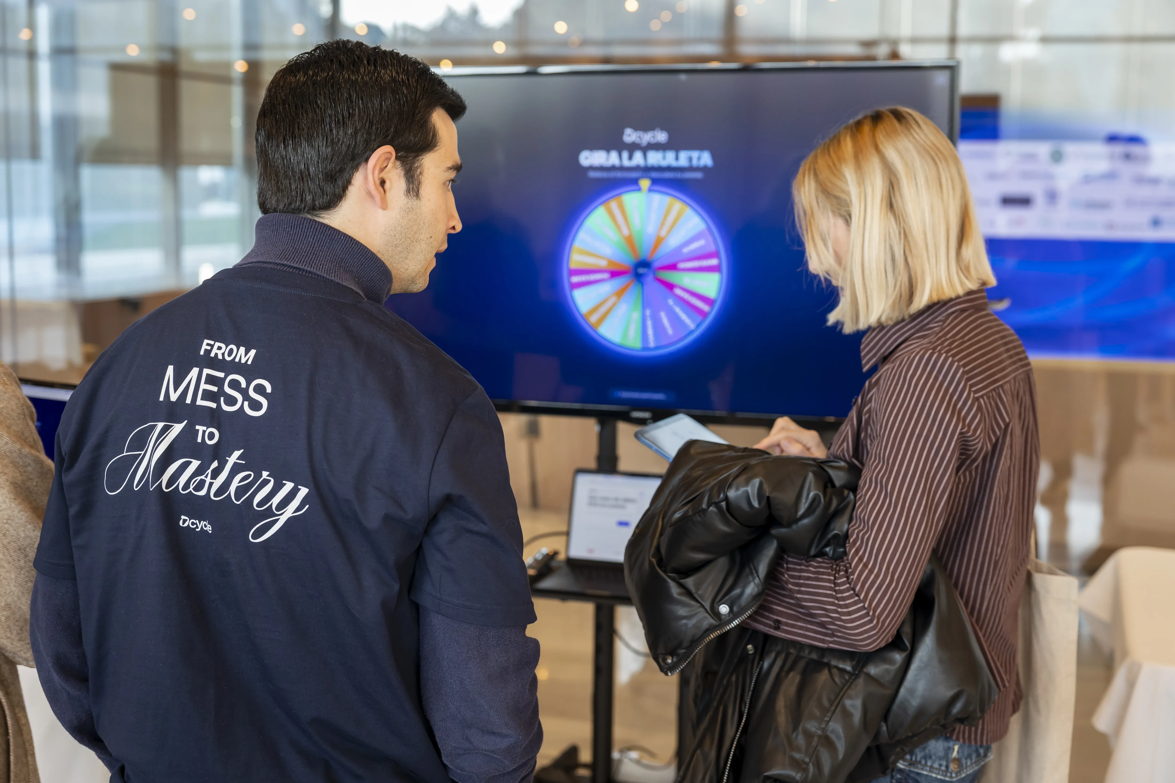 Attendee spinning the Dcycle ESG roulette wheel at the event booth