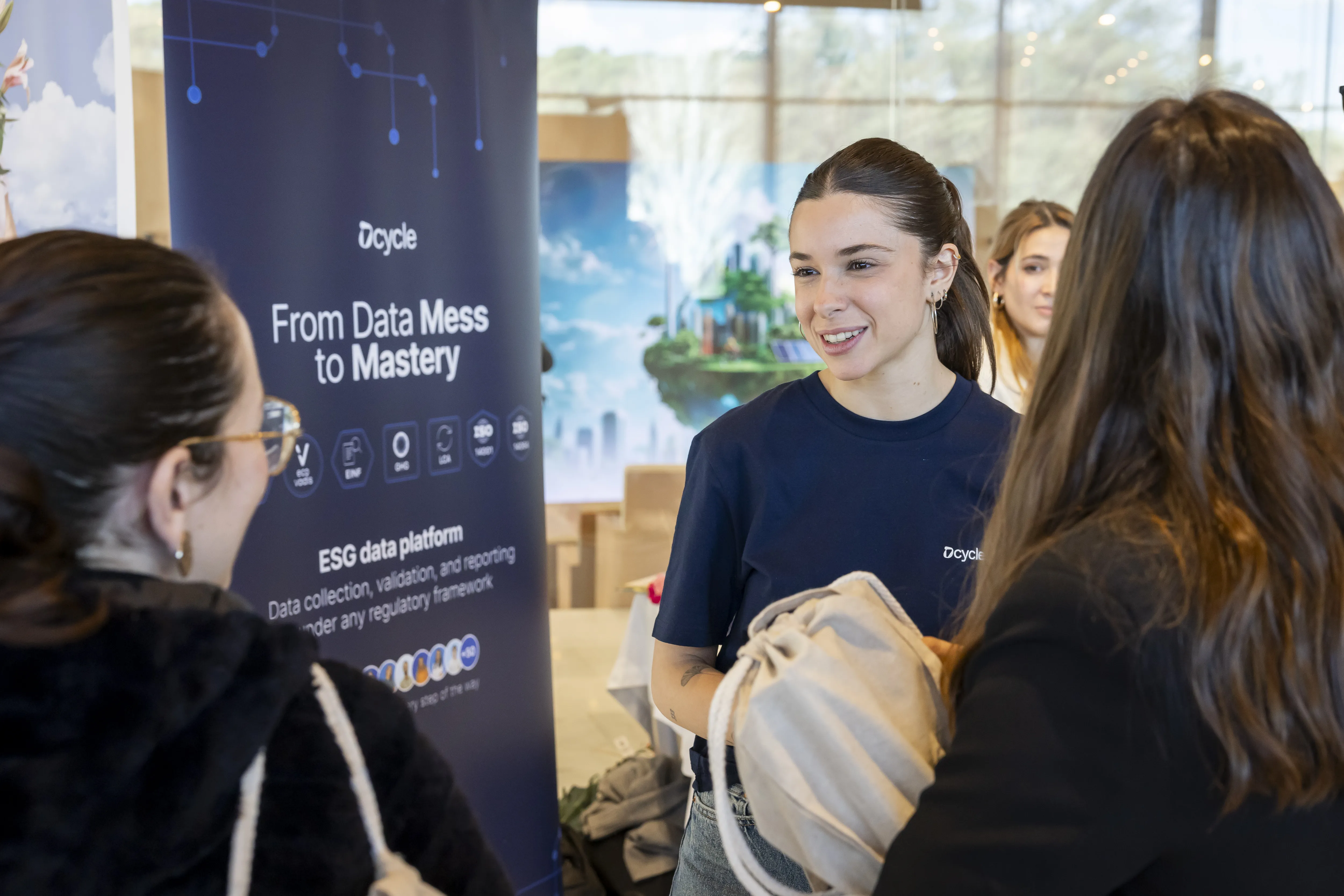 Dcycle team engaging with attendees at the event booth